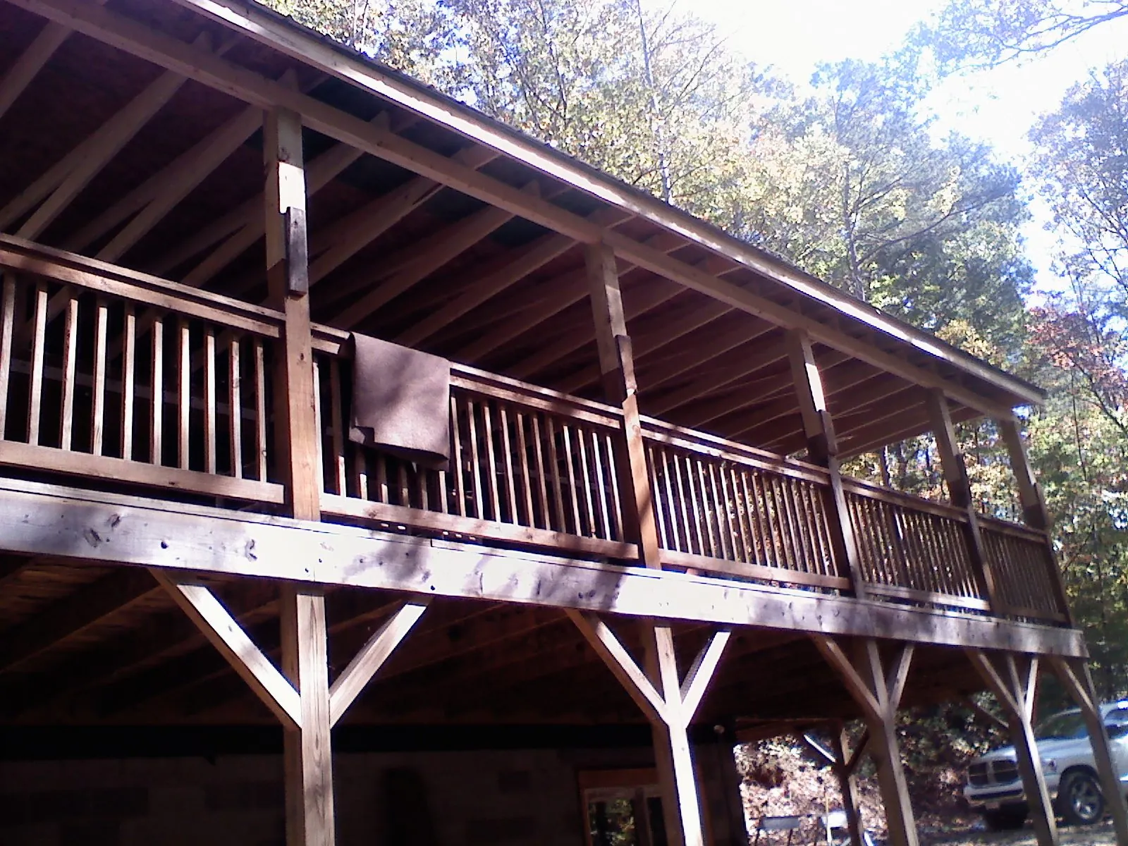 Timber framing under a new elevated porch and deck — Roof Leak Repair in Clarington by Roofing Brothers